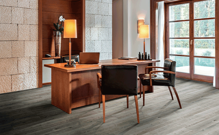 dark luxury vinyl plank flooring in desk seating area